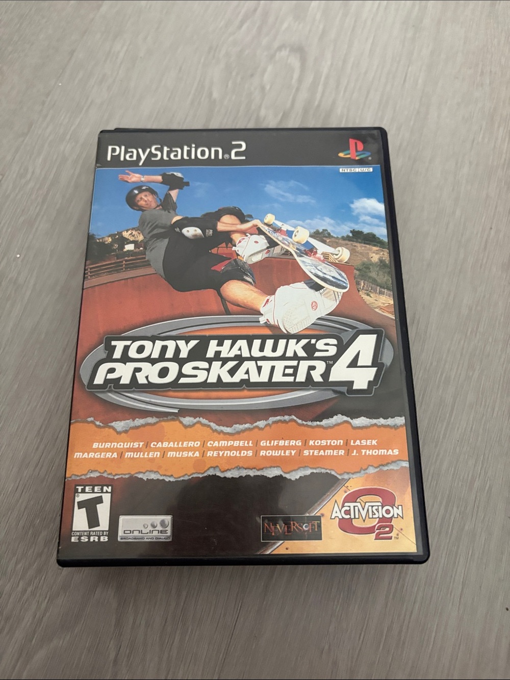 Sony PlayStation 2 Tony Hawk's Pro Skater 4 - Black/Orange/Blue Cover